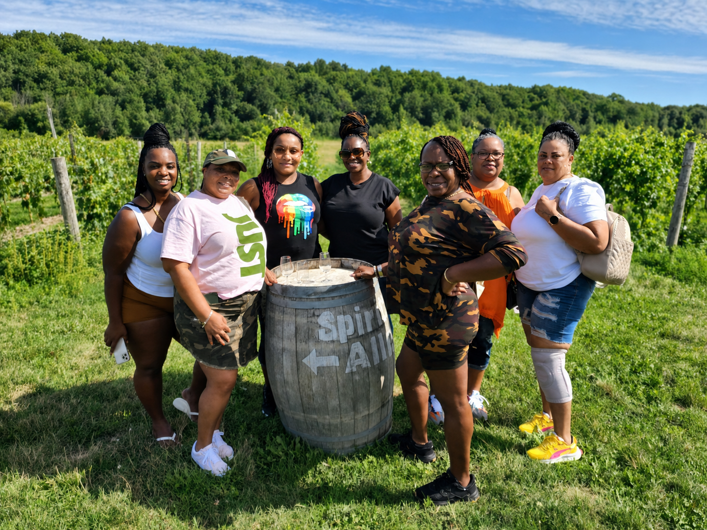 Friends enjoying a sunny vineyard getaway