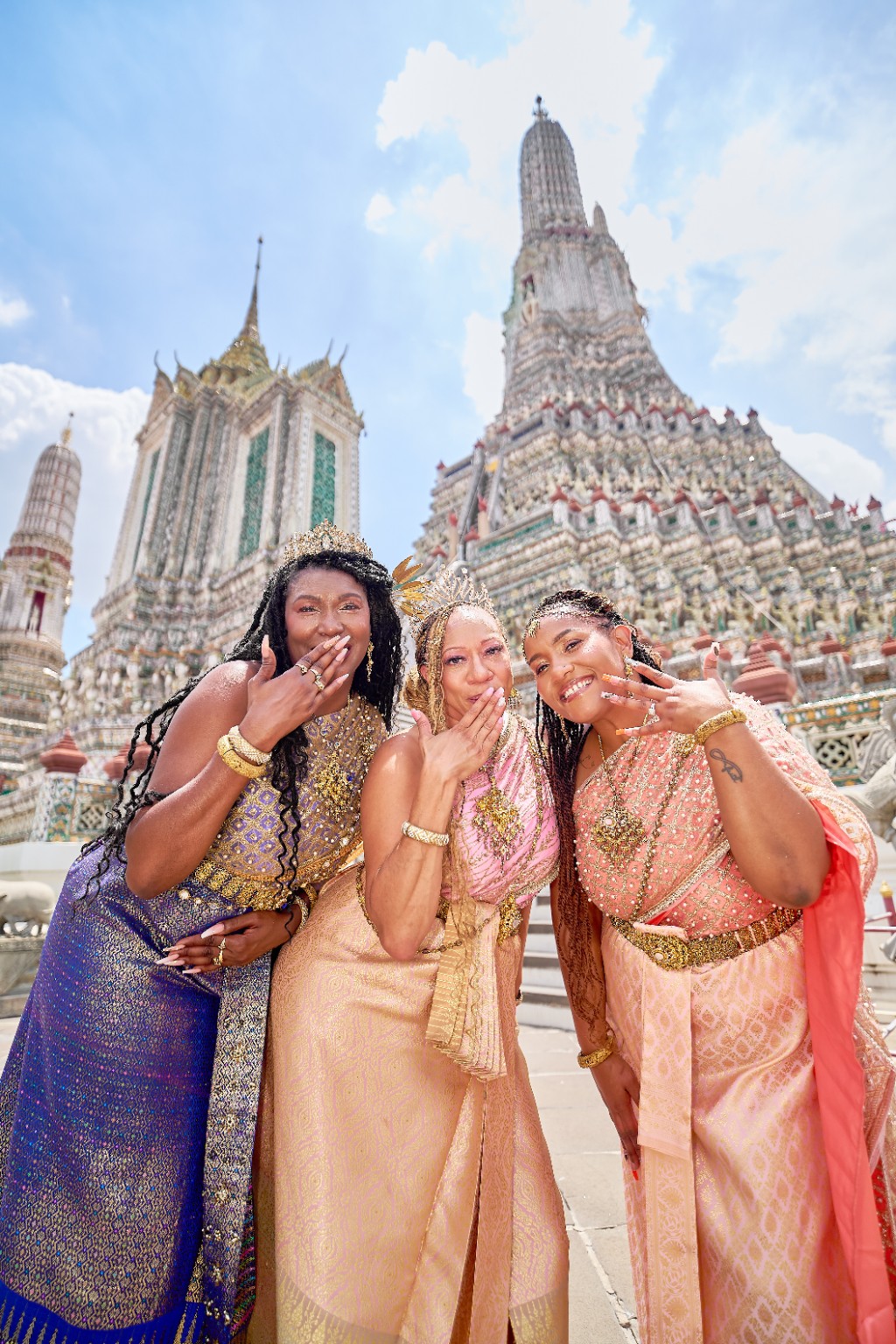 Friends sharing a cultural travel experience in Thailand